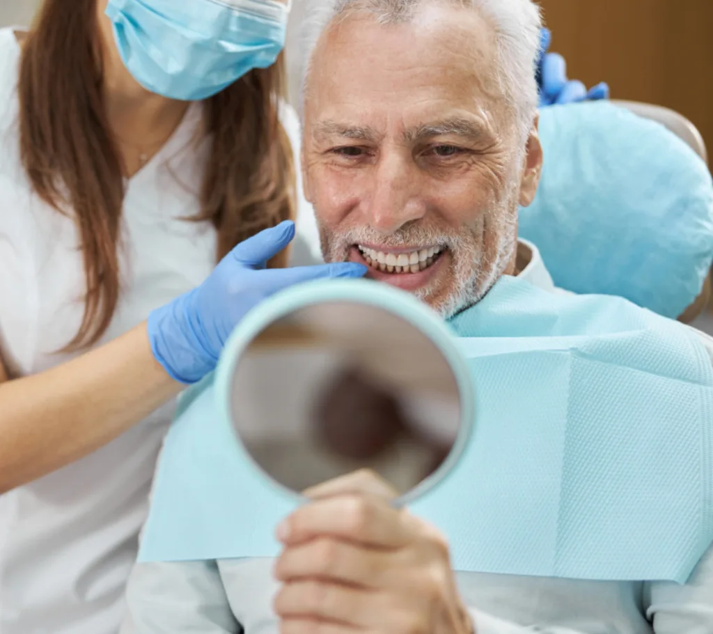 man smiling after dental implants fitting - Dentaluxe